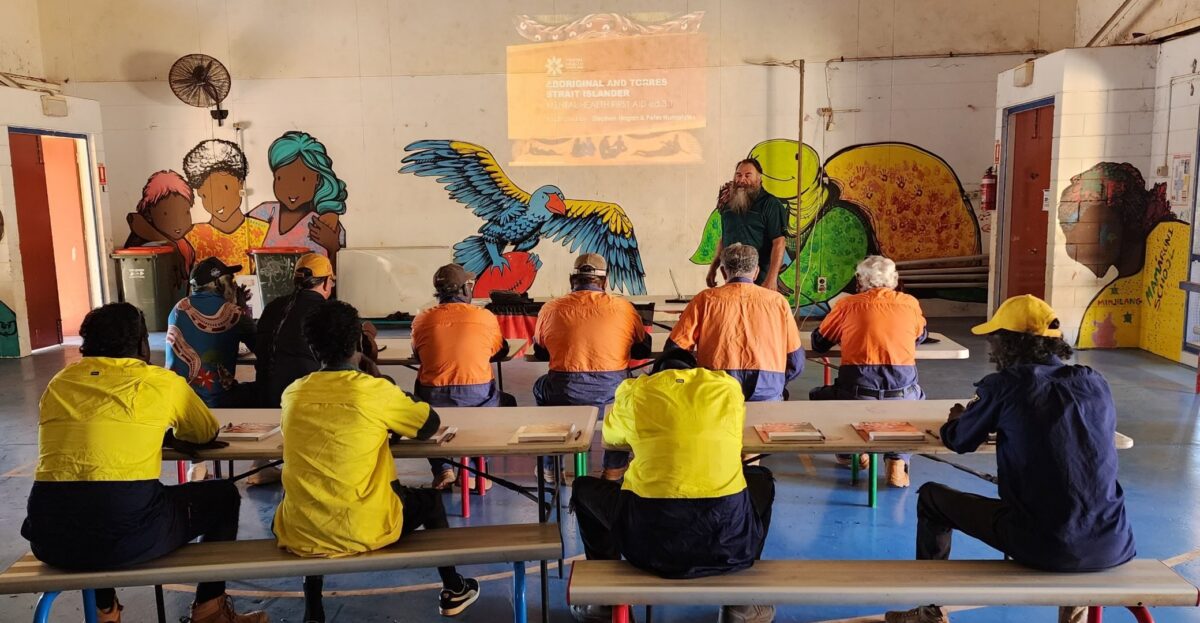 Group of people seated at tables during a training workshop